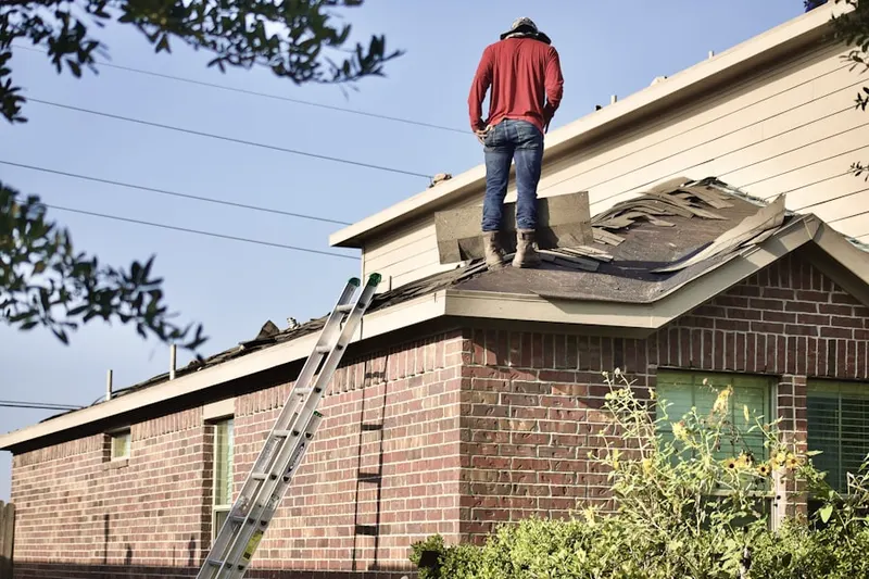 Professional roofer working on a residential roof in East Harrisburg